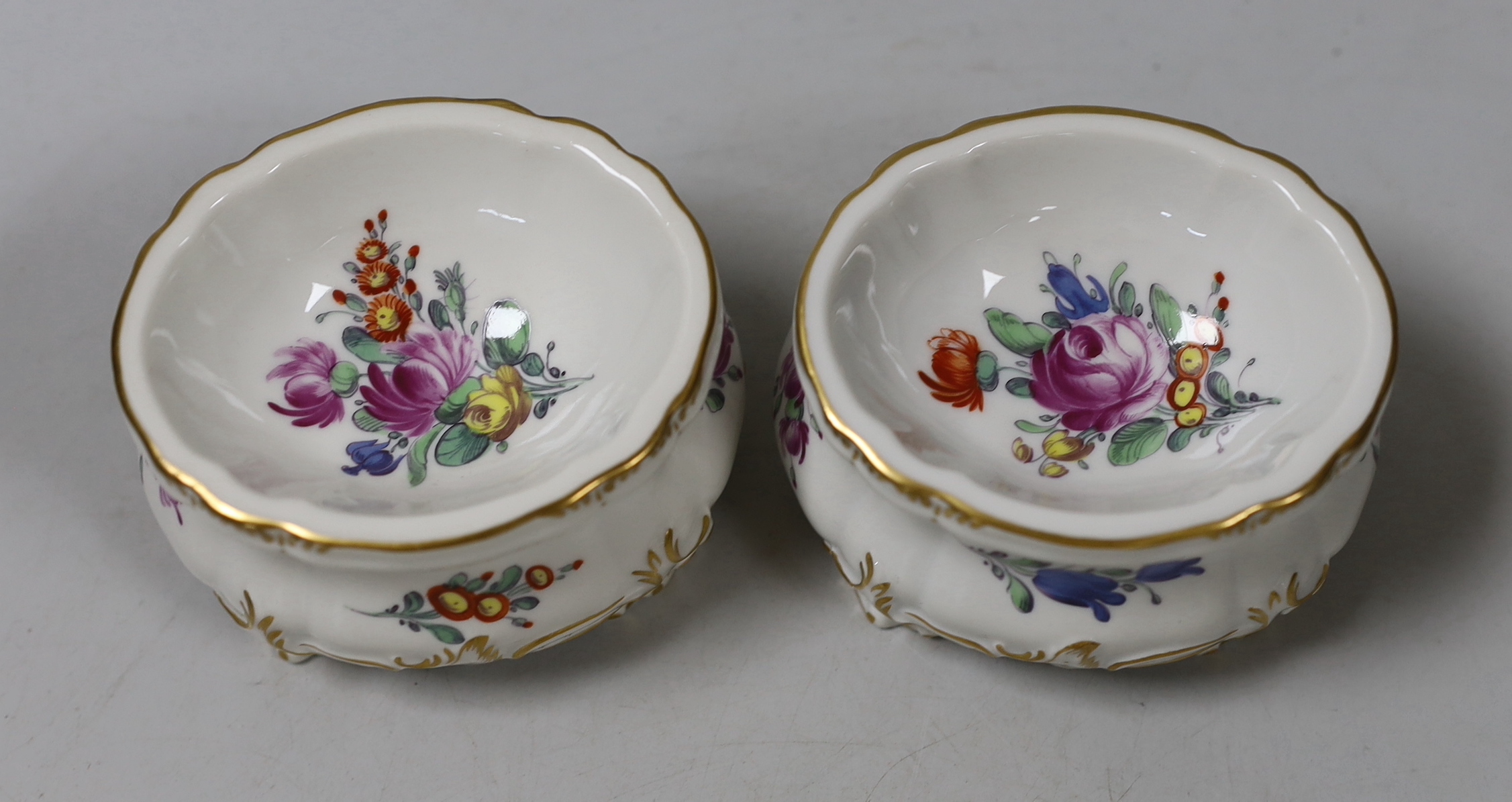 Two Nymphenburg salts pots and covers, 9cm tall